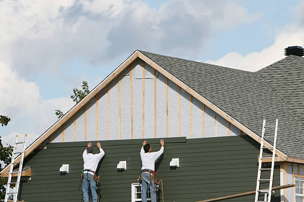 Professional Storm Damage Siding Repair technician working in New Carlisle, IN